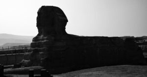 An artistic black and white capture of the Great Sphinx in Giza, Egypt, illustrating grandeur and mystery.